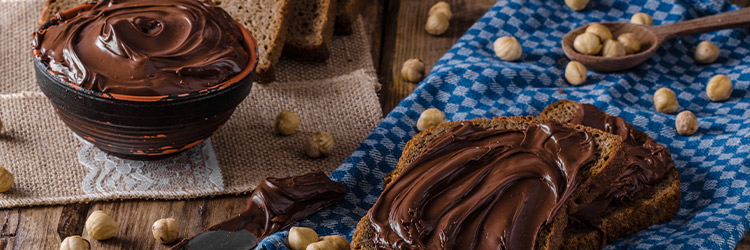 Los Orígenes Históricos de la Butter de Chocolate y Avellanas